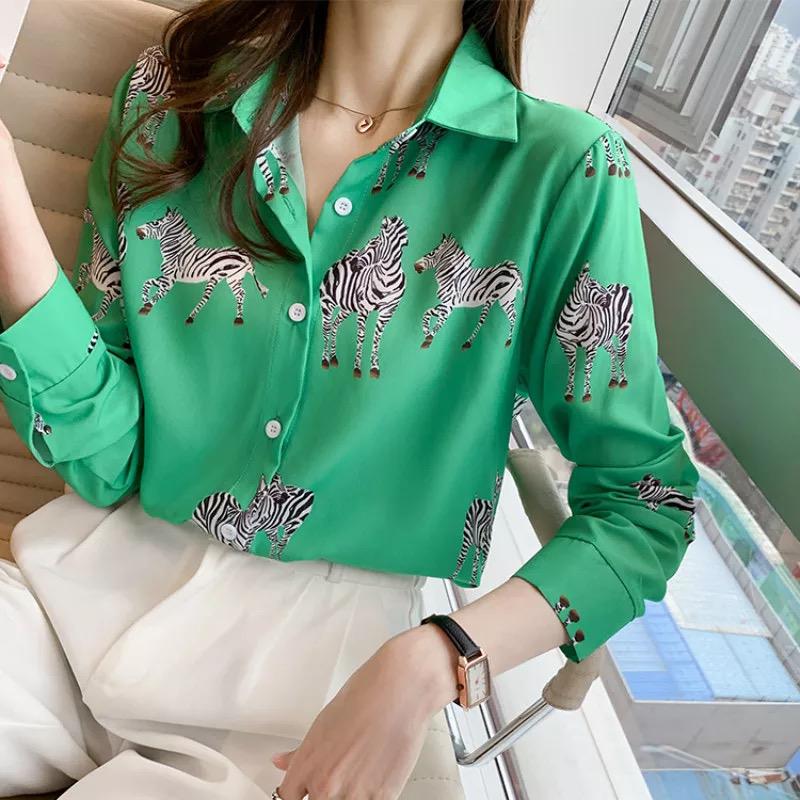 A girl wearing green zebra print shirt