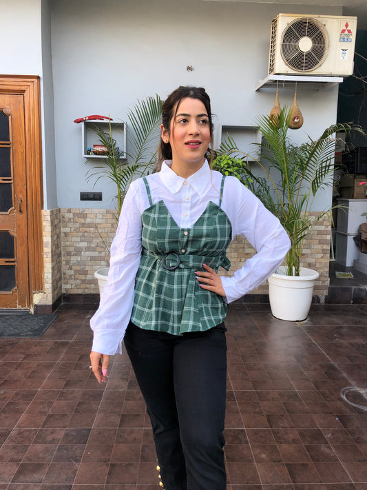 a woman wearing turquoise checked top with polo collar