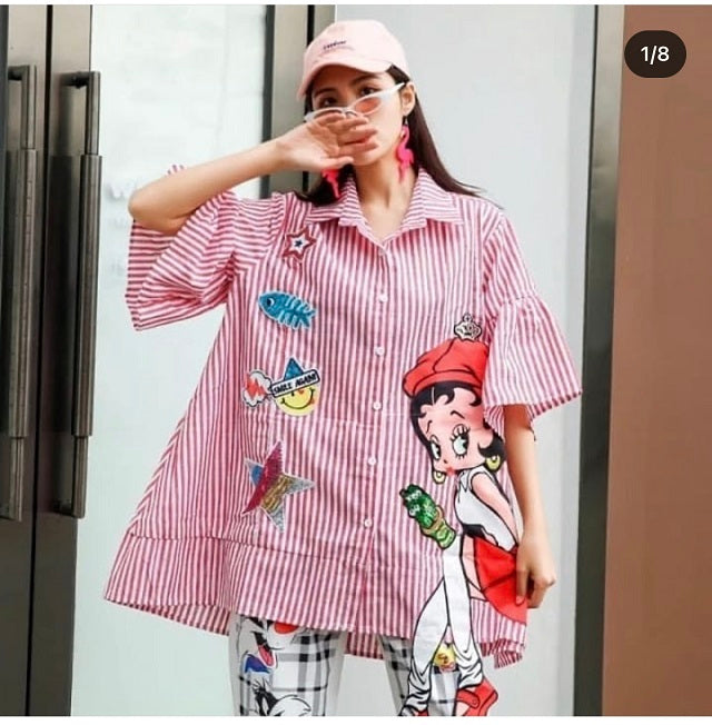 a woman wearing red stripe print doll shirt
