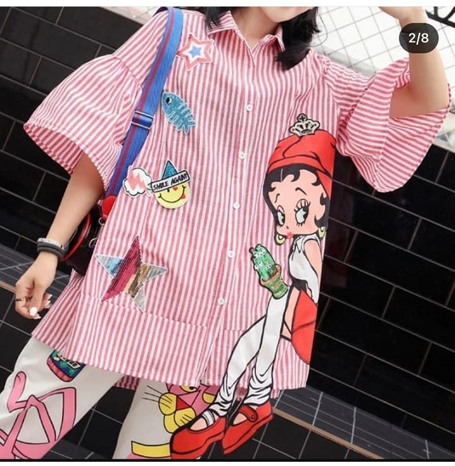 a woman wearing red stripe print doll shirt