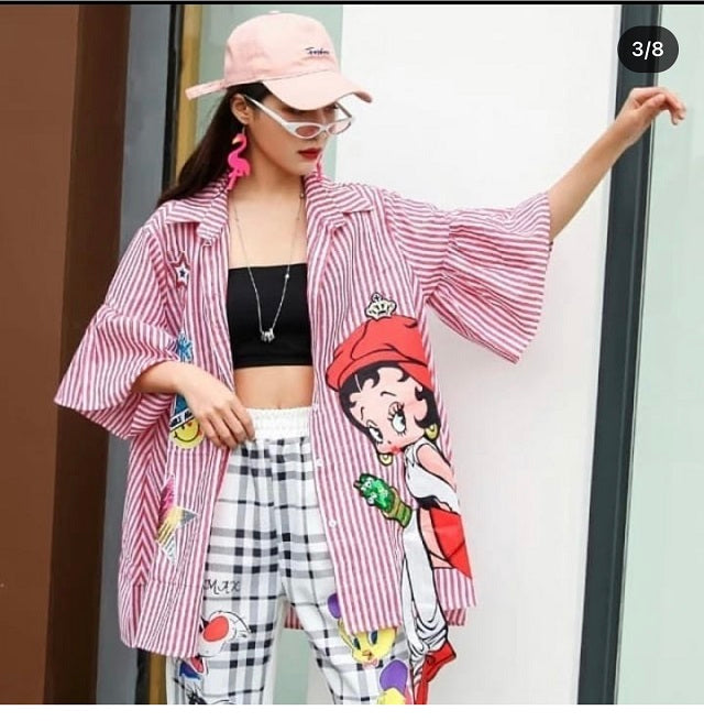a woman wearing red stripe print doll shirt