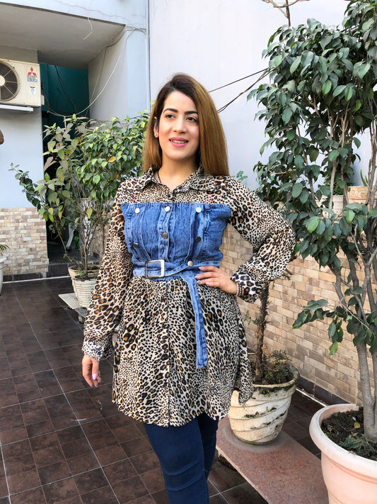 a woman wearing cheetah shade denim stitching long top