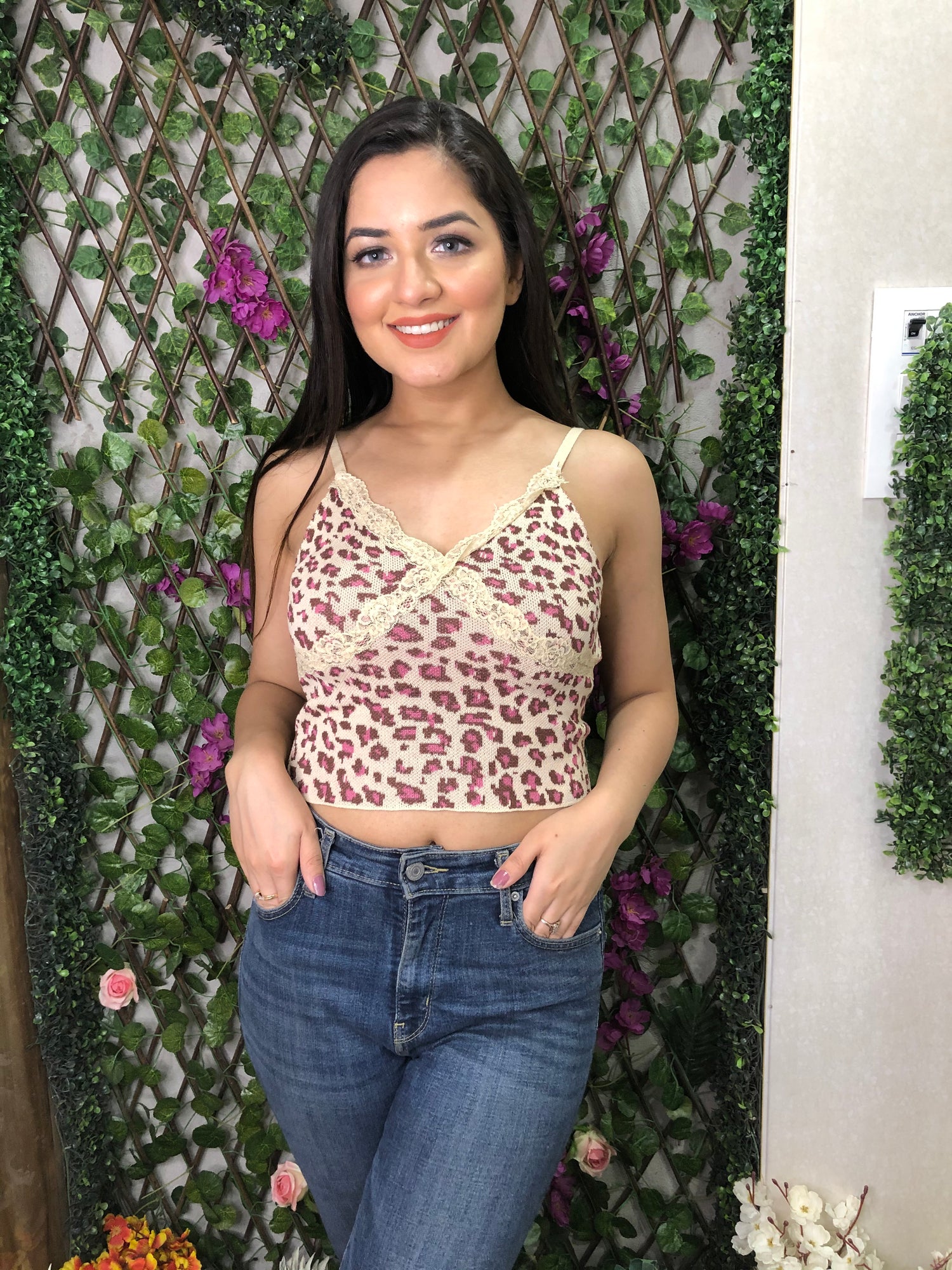 a girl wearing beige cheetah knit top