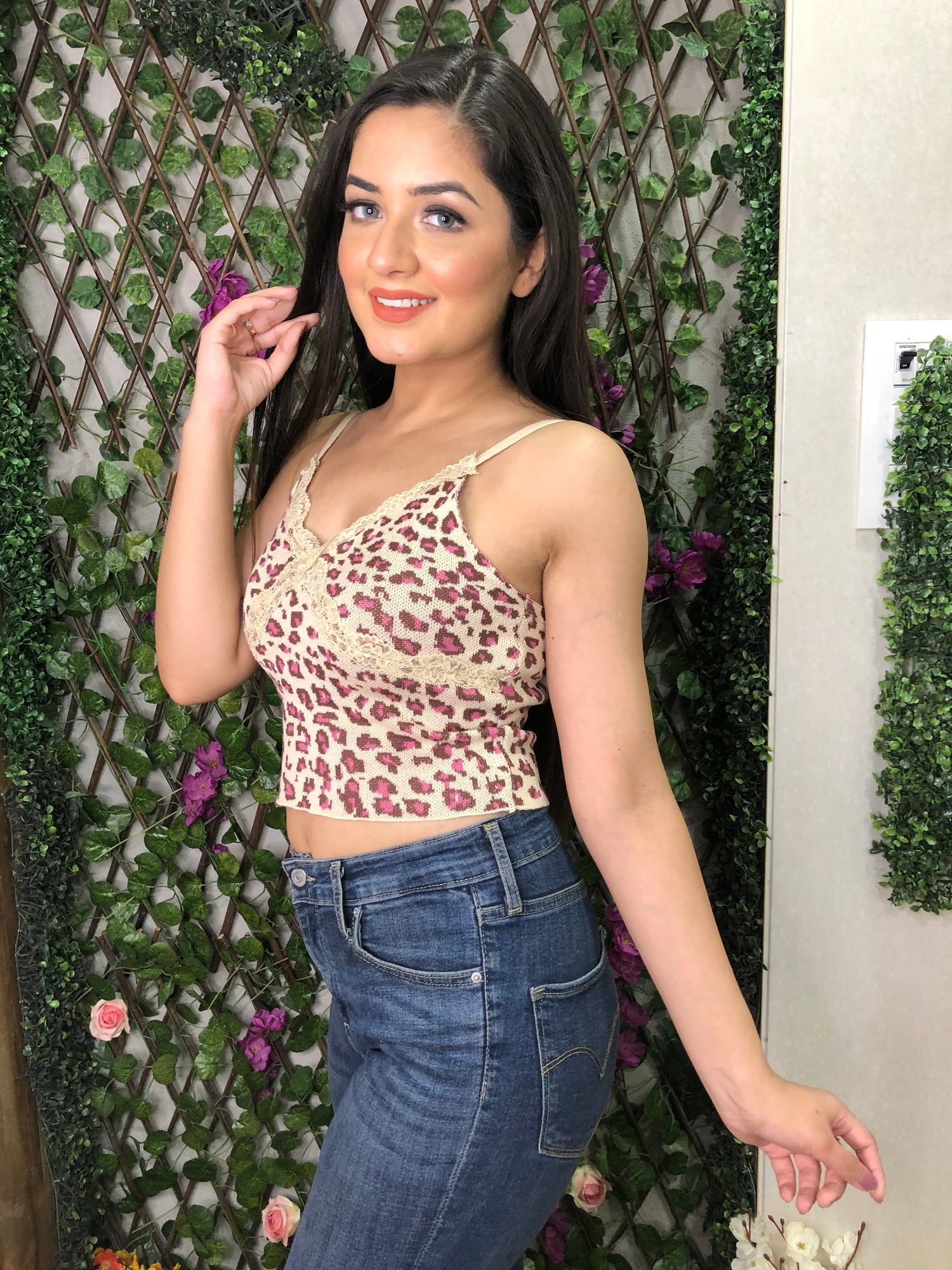 a girl wearing beige cheetah knit top