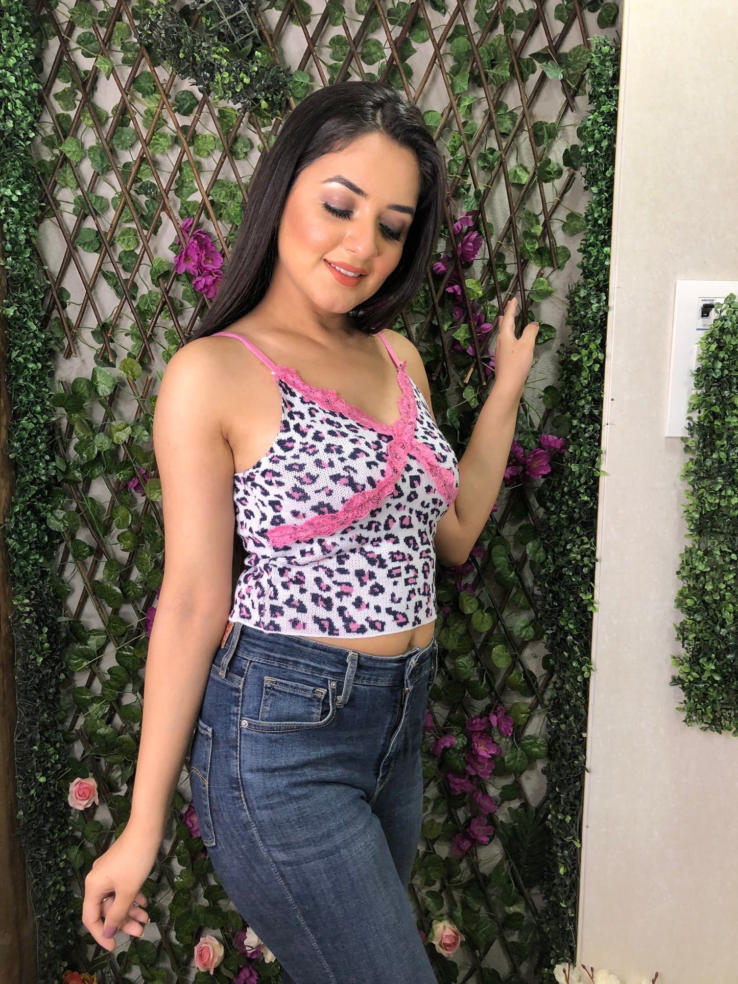 a girl wearing pink cheetah knit top