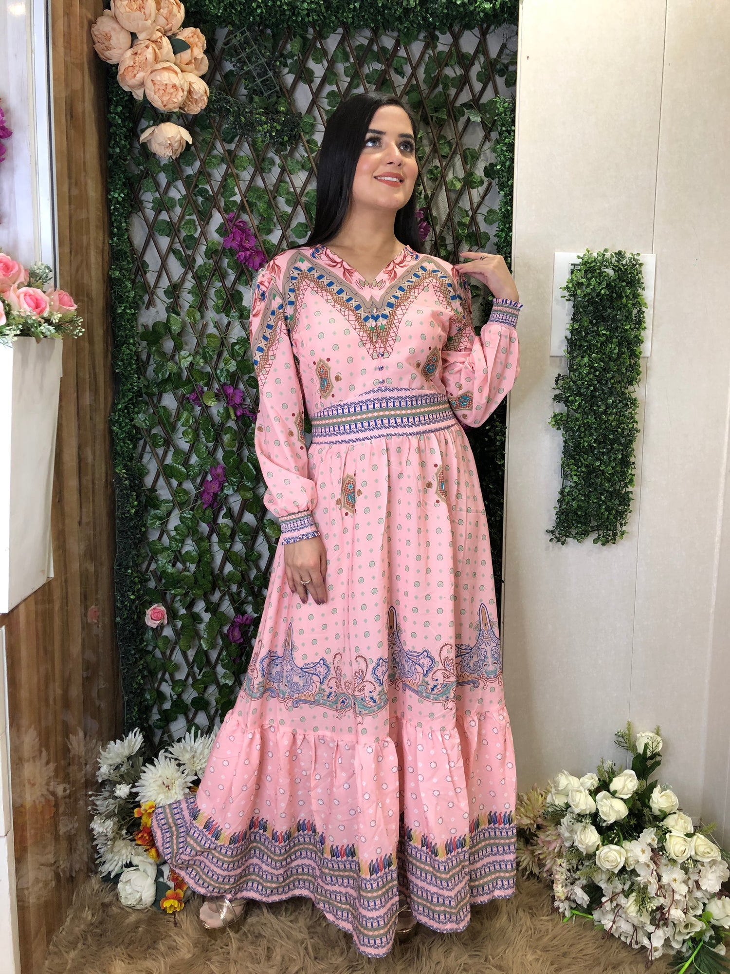 a woman wearing a pink boho maxi dress