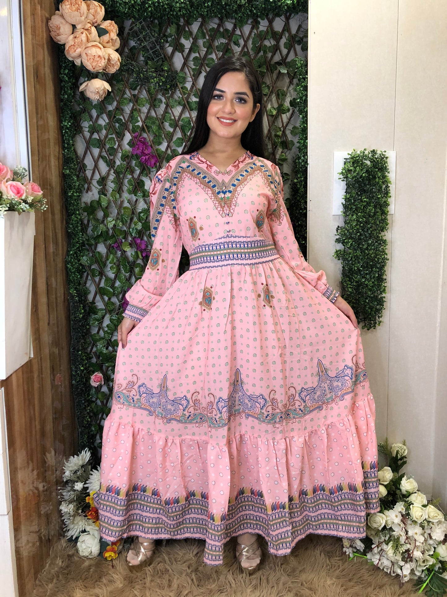 a woman wearing a pink boho maxi dress