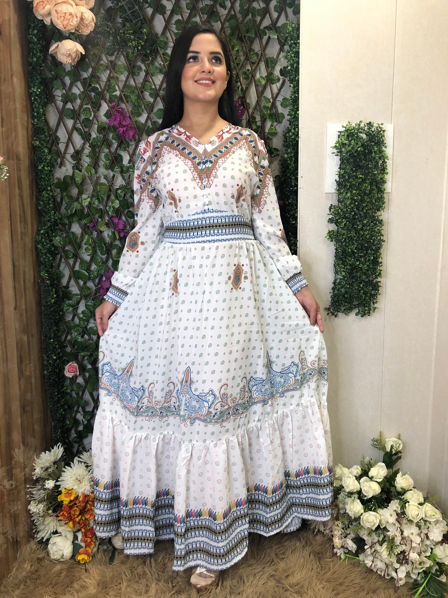 a woman wearing a white boho maxi dress