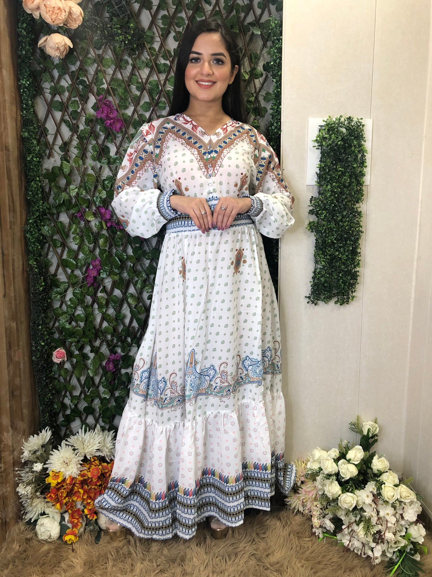 a woman wearing a white boho maxi dress